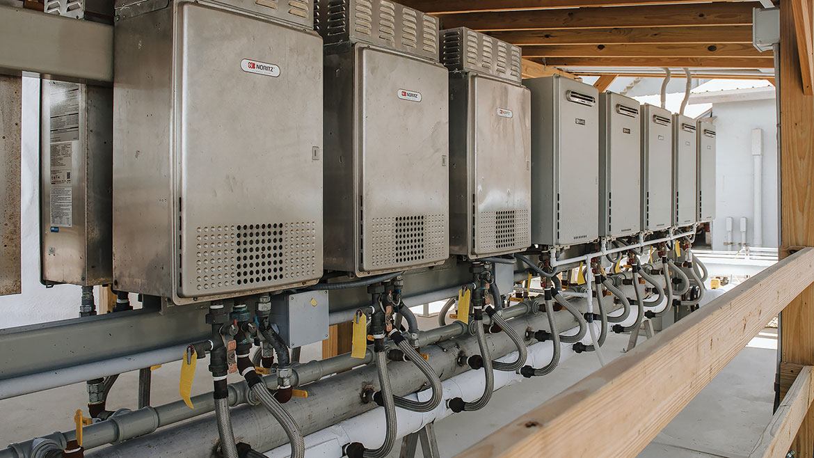 The installation at Wedgworth’s Lake Placid, Florida, facility combined seven Noritz NC380 units (left in photo) — originally installed at the Clewiston, Florida, plant — with 10 new Noritz NCC300 units (right in photo).