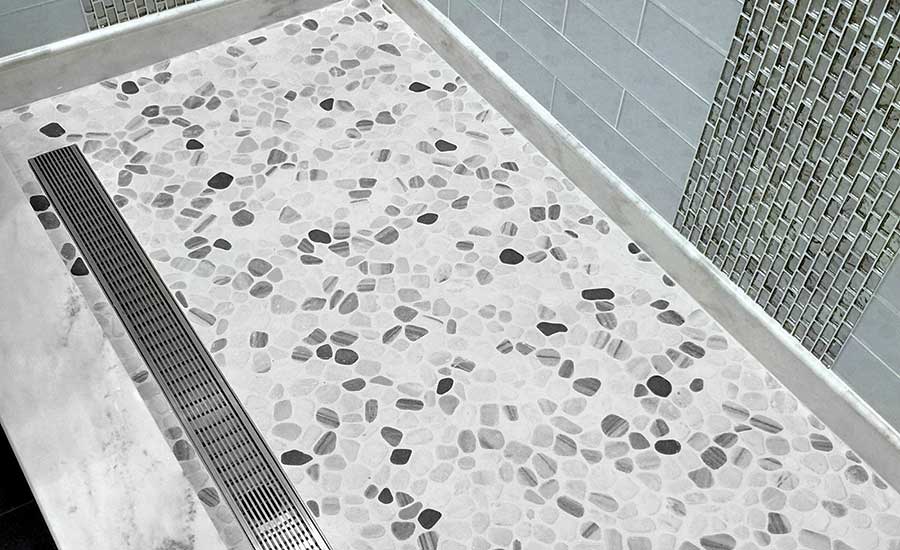 LUXE tile insert linear drain vanishes into the shower floor